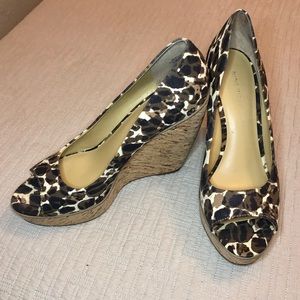 Nine West “Wildthingo” canvas leopard platforms